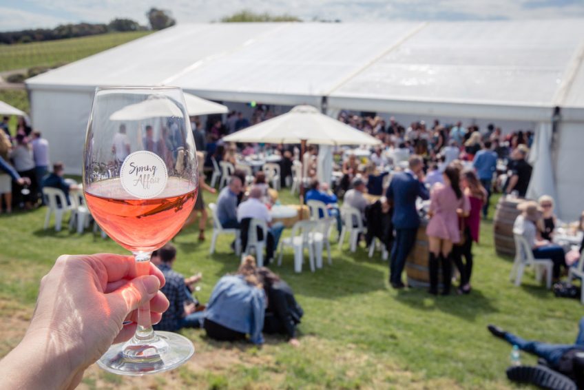 glass of rose raised
